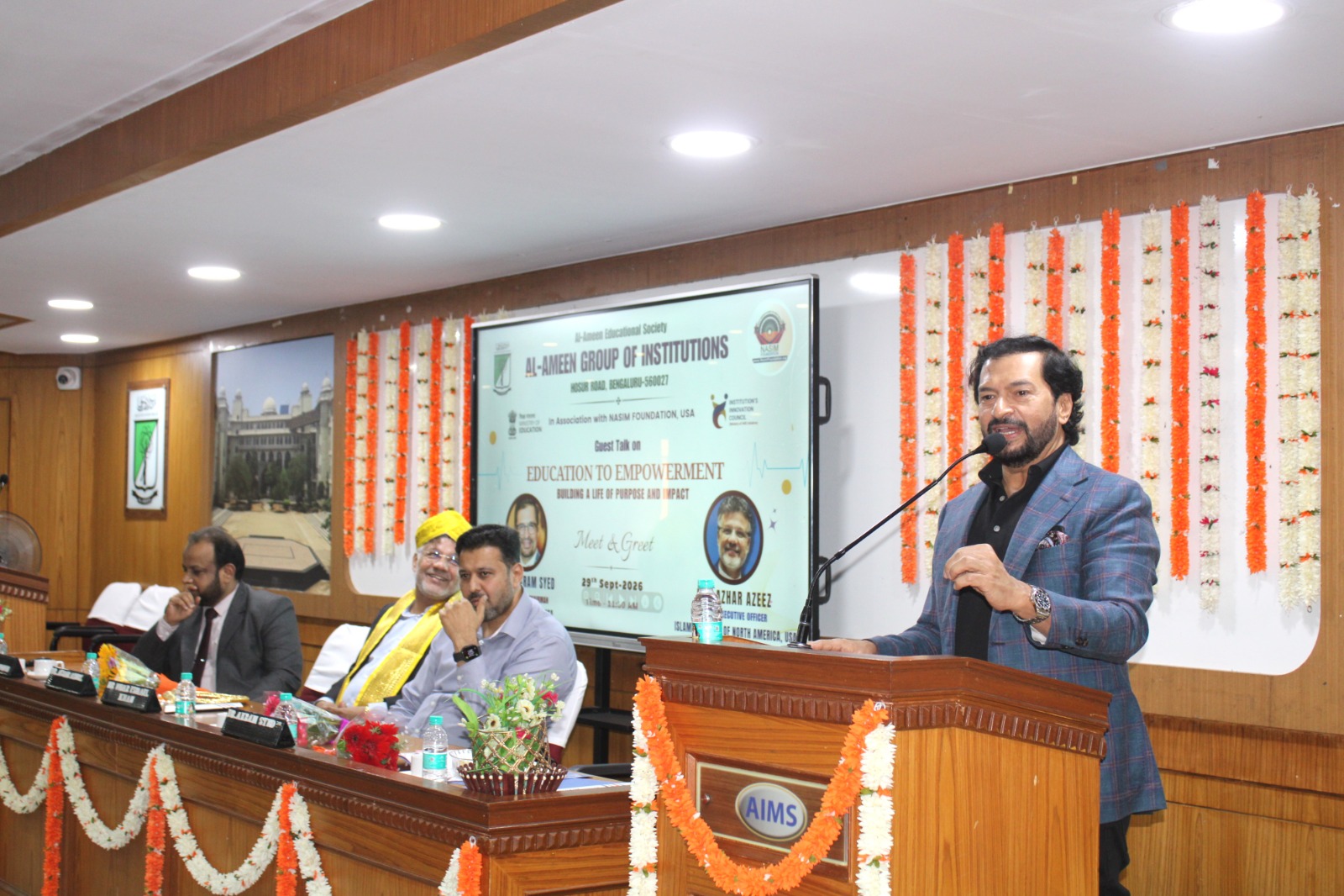 Akram Syed speaking at the Education to Empowerment event at Al-Ameen Group of Institutions
